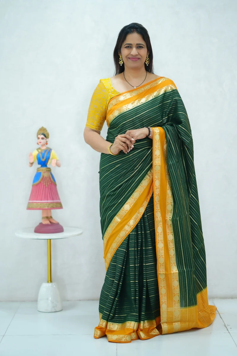 Crepe silk saree in green and mustard yellow combination