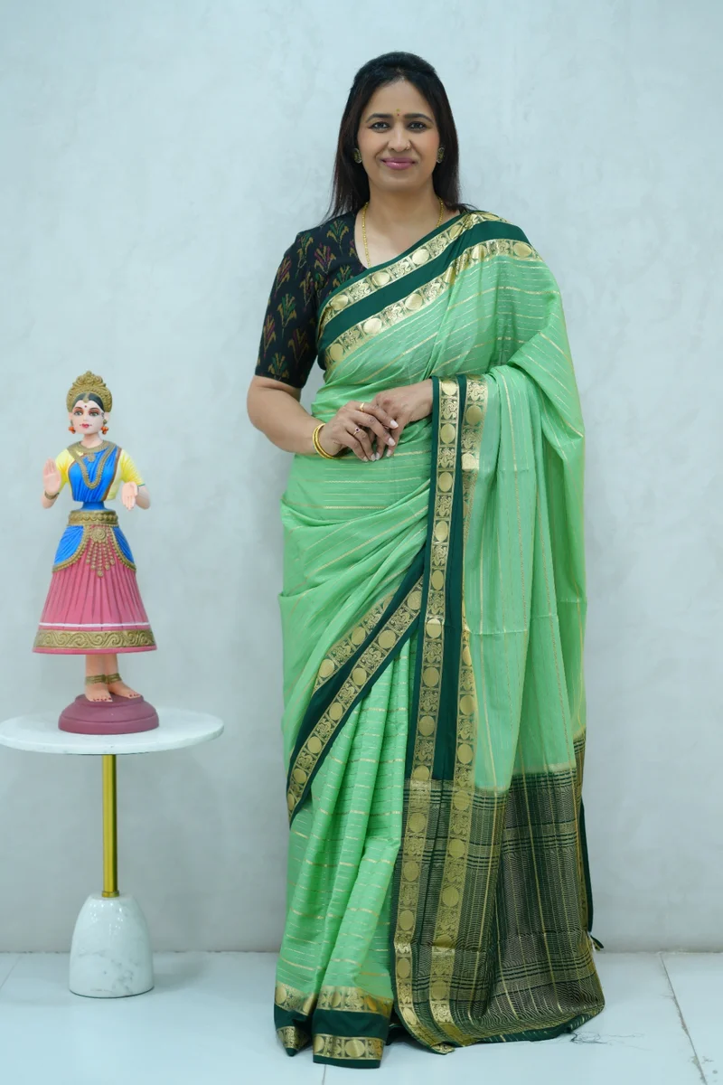 Crepe silk saree in pastel green and dark green combination